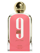Load image into Gallery viewer, 9 AM Pour Femme by Afnan featuring mandarin, bergamot, grapefruit, black currant, raspberry, amber, and musk notes in an elegant perfume bottle.