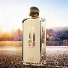 Load image into Gallery viewer, 9 AM by Afnan featuring mandarin, cardamom, lavender, green apple, patchouli, and musk notes in an elegant perfume bottle.