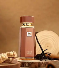 تحميل الصورة إلى عارض المعرض، Liquid Brun by French Avenue featuring cinnamon, vanilla, praline, and guaiac wood notes in an elegant perfume bottle.