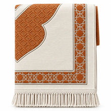 Load image into Gallery viewer, Orange Islamic prayer mat with ornate traditional decorative pattern and fringe